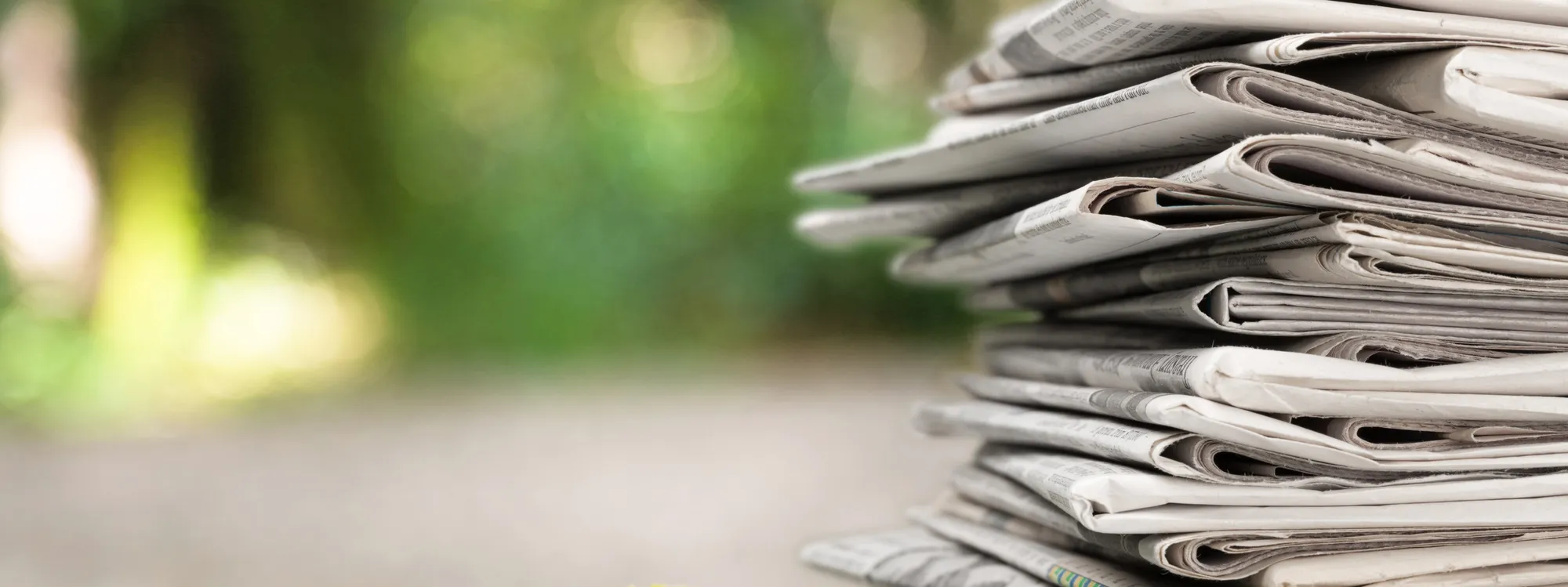 pile-newspapers-stacks-blur-background